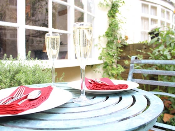 Dine al fresco in the pretty courtyard garden in London