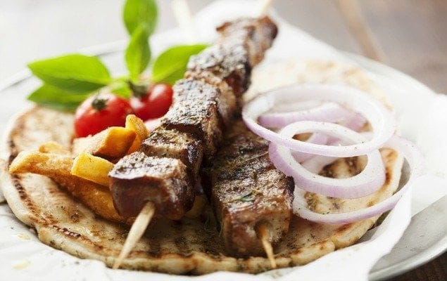 grilled meat skewer on pita bread 